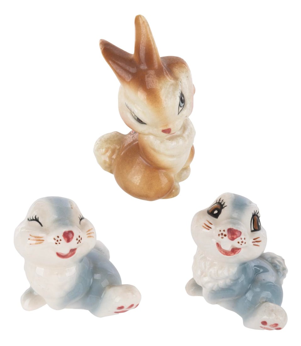 A Trio of "Bambi" Bunnies Ceramic Figurines.: (American Pottery Co., 1940s) Three "Bambi" ceramic figurines, including two of Thumper and one Miss Bunny with a partial "Girlfriend" sticker on her lower back. Standing from 3" to 4" tall, the
