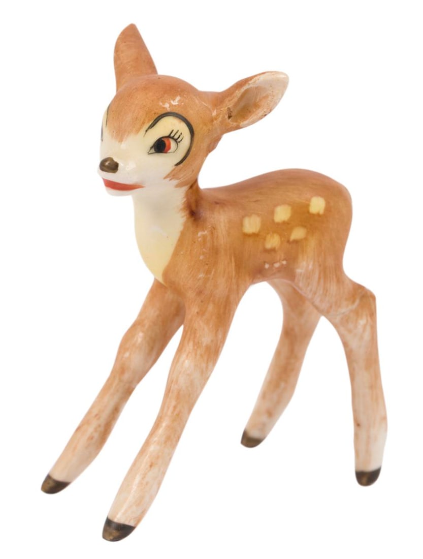 A 1950s "Bambi" Faline Figurine by Goebel.: (Goebel, 1950s) A ceramic figurine of Faline from "Bambi." Measuring 1.25" x 2.5" x 3" tall, the figurine is in fair condition with repairs to one leg and one ear.