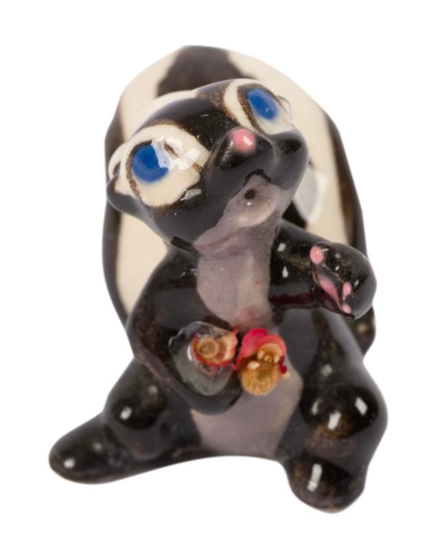 A "Bambi" Flower Miniature Figurine by Hagen Renaker.: (Hagen-Renaker, 1950s) A miniature figurine of Flower from "Bambi" by renowned Californian ceramist, Hagen-Renaker. Measuring 0.75" x 1.5" and 1" tall, the figurine is in very good condition with