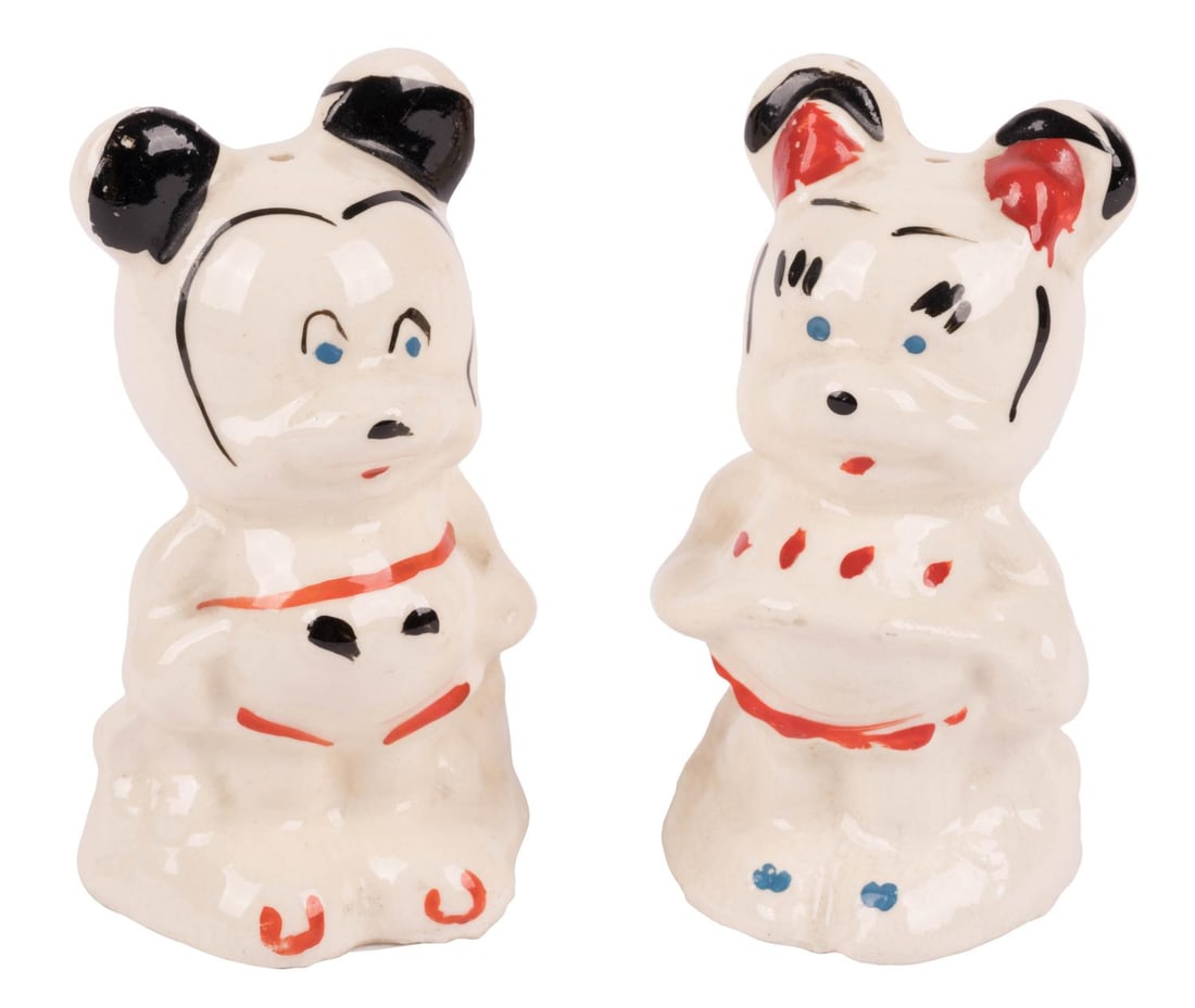 A Mickey and Minnie Mouse Salt and Pepper Shaker Set.: (Leeds, 1940s-50s) A ceramic salt and pepper shaker set of Mickey and Minnie Mouse, manufactured by Leeds China. Leeds had a license to produce Disney ceramics from 1944 until 1954. Measuring 1.75" x