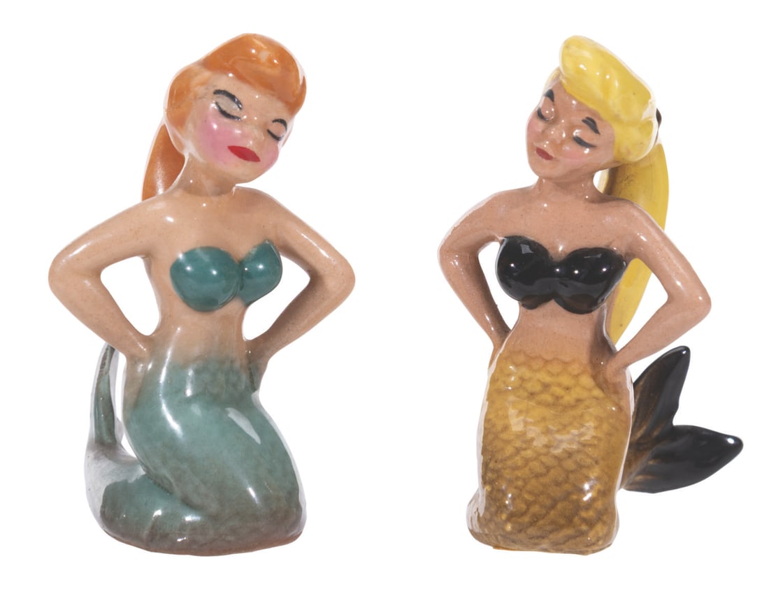 A Pair of Hagen Renaker "Peter Pan" Mermaid Ceramic Figurines.: (Hagen-Renaker, 1950s) A pair of rare ceramic mermaid figurines from "Peter Pan," by Hagen-Renaker. Measuring 2" tall each, the mermaids are in very good condition with light crazing and spots of