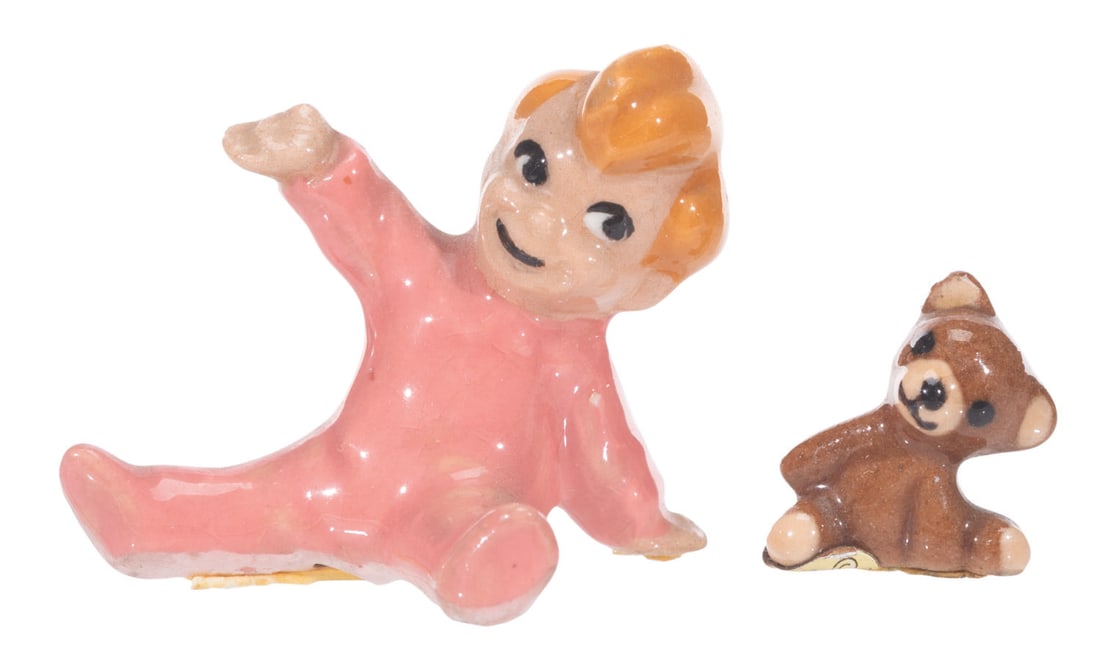 A Pair of Hagen-Renaker Michael Darling and Bear Figurines.: (Hagen-Renaker, 1950s) A pair of ceramic figurines of Michael Darling and his bear from "Peter Pan," created by renowned ceramist Hagen-Renaker. Ranging in size from the 0.5" bear to the 1" tall