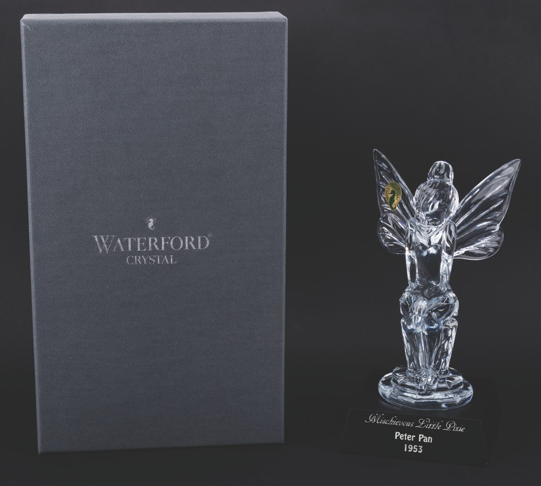 A Crystal "Peter Pan" Tinker Bell Figurine.: (Waterford, 1997) A limited edition Waterford crystal figure of Tinker Bell titled "Mischievous Little Pixie," released exclusively for the 1997 Disneyana Convention. Standing 8" tall atop the 4" x