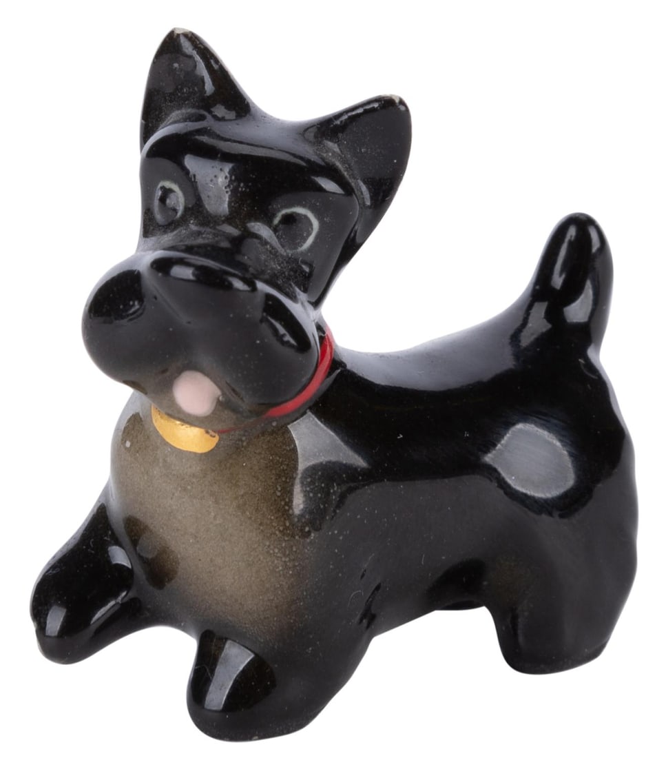 A "Lady and the Tramp" Jock Ceramic Figurine.: (Hagen-Renaker, 1950s) A ceramic figurine of Jock from "Lady and the Tramp," manufactured by Californian ceramist Hagen Renaker. Measuring 0.75" x 1.5" x 1.5" tall, the figurine is in good condition,