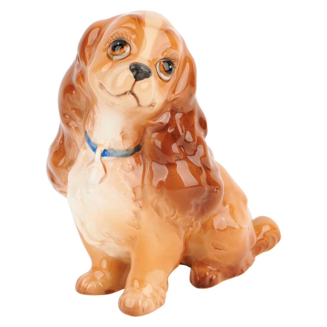 A "Lady and the Tramp" Lady Ceramic Figurine.: (Enesco, 1970s-80s) A ceramic figurine of Lady from Walt Disney's "Lady and the Tramp" manufactured by Enesco and likely sold at Disneyland in the 1970s-80s. Measuring 3.75" x 3.2.5" and 4.5" tall,