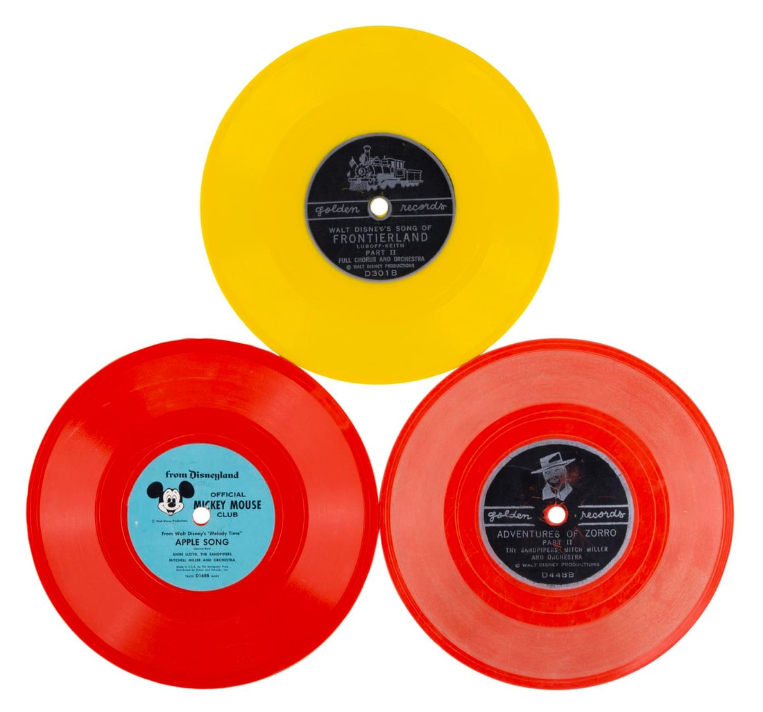 A Collection of Disney Records.: (Disneyland/Golden Records, 1950s) Three Disney records, including the singles "Walt Disney's Song of Frontierland," "Adventures of Zorro," and "Apple Song" and "Pioneer Song" from the package film "M
