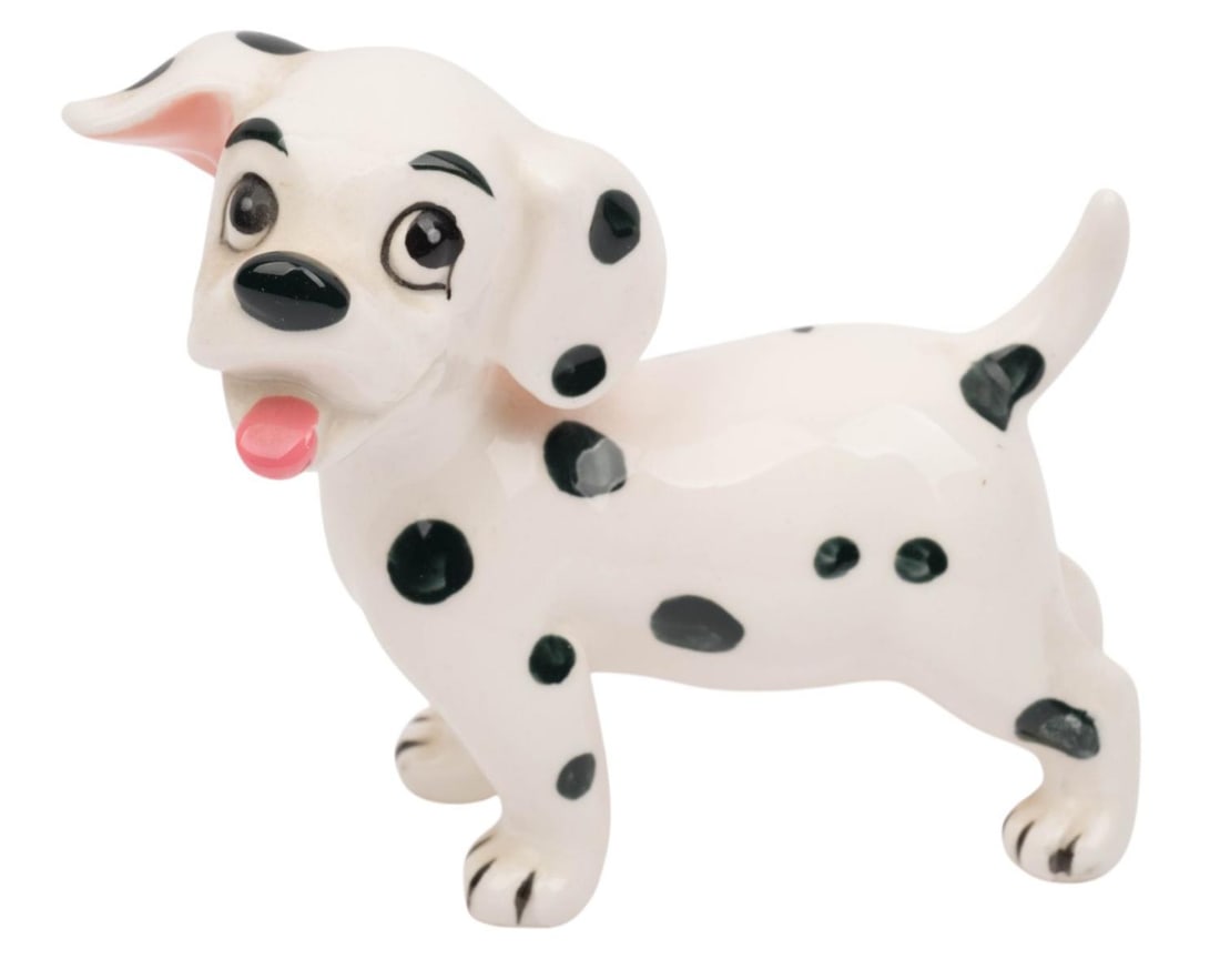 A "One Hundred and One Dalmatians" Rolly Figurine.: (Enesco, 1960s-70s) A ceramic figurine of the puppy Rolly from "One Hundred and One Dalmatians." Measuring 4.25" x 2.25" and 4.25" tall, the figurine is in very good condition with very light wear