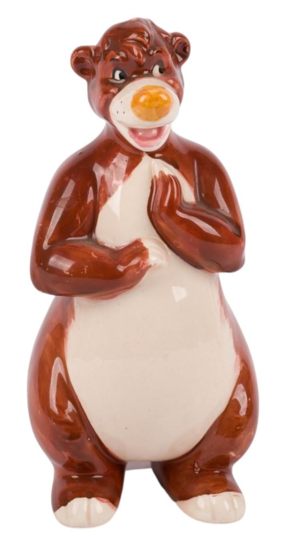A Baloo "The Jungle Book" Figurine.: (Enesco, 1960s-70s) A ceramic figurine of Baloo from "The Jungle Book" uniquely glazed brown instead of grey. Measuring 2.25" x 2.5" x 5.25" tall, the figurine is in very good condition with light