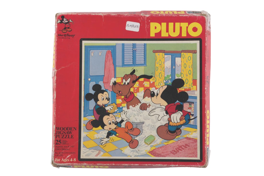 A 25 Piece Wooden Pluto Jigsaw Puzzle.: (Hope, 1970s) A 25-piece wooden jigsaw puzzle "Pluto Takes a Bath," with the original box. Measuring 8" x 8", the puzzle is in good condition with wear from use, and the box in fair condition with