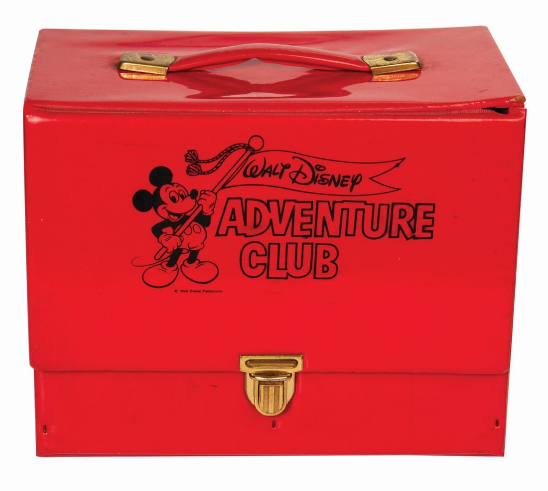 A Walt Disney Adventure Club Mickey Mouse Case.: (Disney, 1970s) A rare Walt Disney Adventure Club case with a metal clasp. The club included membership cards and activity pages for kids. Measuring 6.25" x 11.75" and 9.75" tall, the red vinyl case