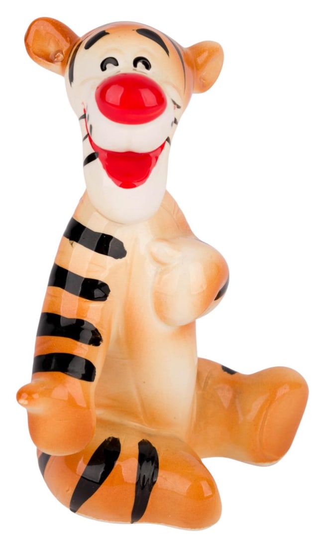 A 1970s Tigger Ceramic Figurine.: (Disney, 1970s) A ceramic figurine of Tigger from "The Many Adventures of Winnie the Pooh." Measuring 3" x 2.25" and 4.25" tall, the figurine is in fine condition.