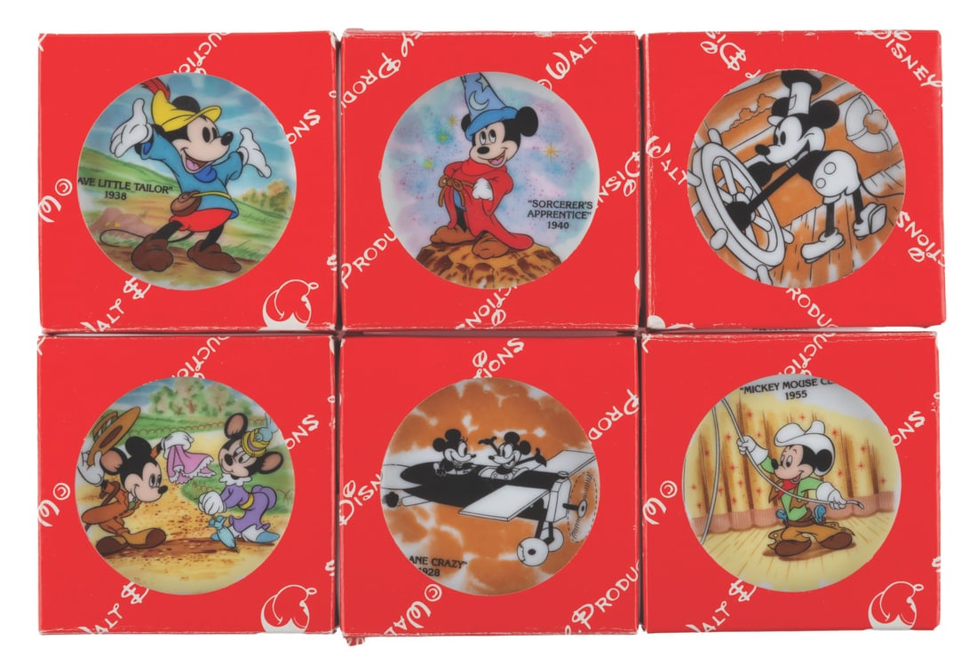 A Collection of Mickey 50th Mini Plates.: (Disneyland/Walt Disney World, 1978) A collection of six decorative mini plates commemorating Mickey's 50th. The set features imagery of Mickey from classic films such as "Plane Crazy," "Steamboat