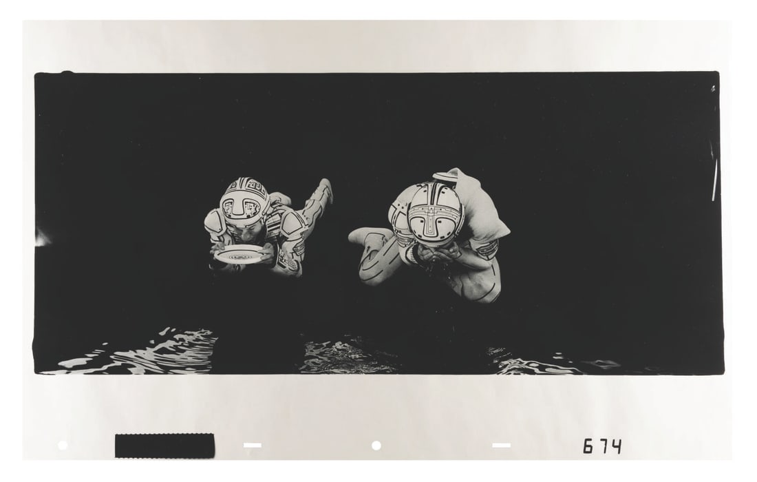 A "Tron" Ektachrome Continuous-Tone Transparency.: (Disney, 1982) An original Ektachrome continuous-tone transparency cel of TRON and Flynn from Disney's 1982 feature film "Tron." Each frame of film was transferred to several transparencies so that