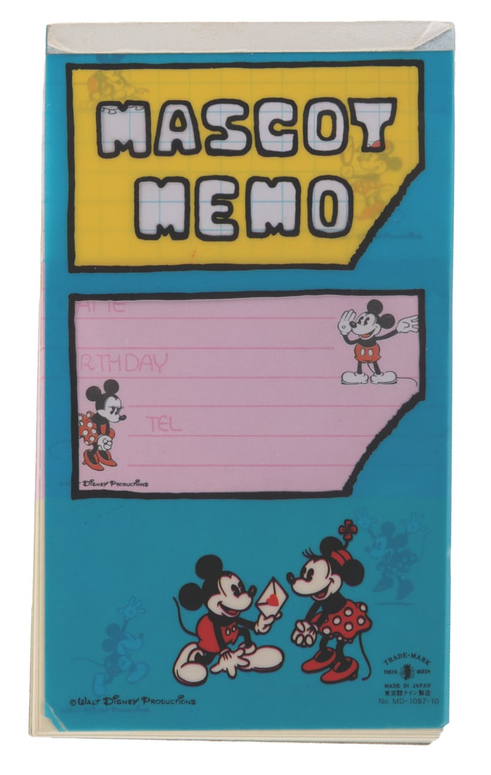A Mickey Mouse Mascot Memo Pad.: (Disney, 1980s-90s) A "Mascot Memo" notepad with pages featuring Mickey and Minnie on three different styles of notes. Measuring 3.5" x 6.25", the pad is in good condition with handling wear,