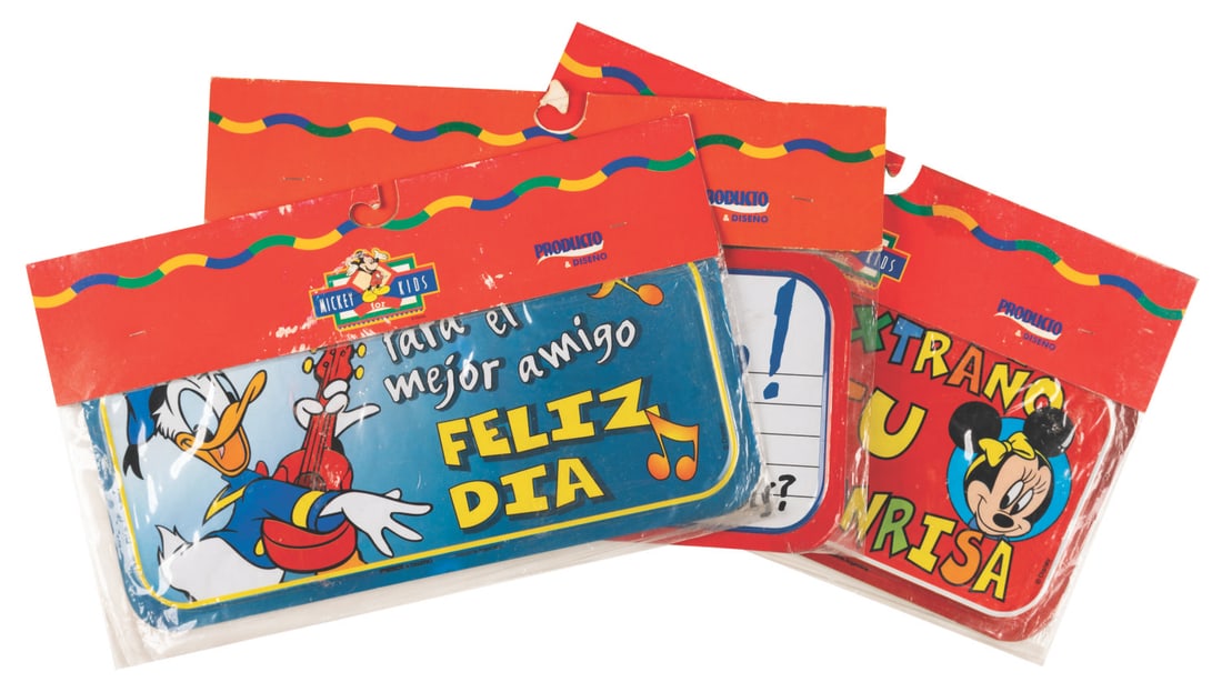 Three Mickey for Kids Spanish Friendship Signs.: (Disney, 1990s) Three metal license plate-shaped signs with Mickey and friends featuring friendly expressions in Spanish. Measuring 5.25" x 11.25", the signs are in good condition, in their original