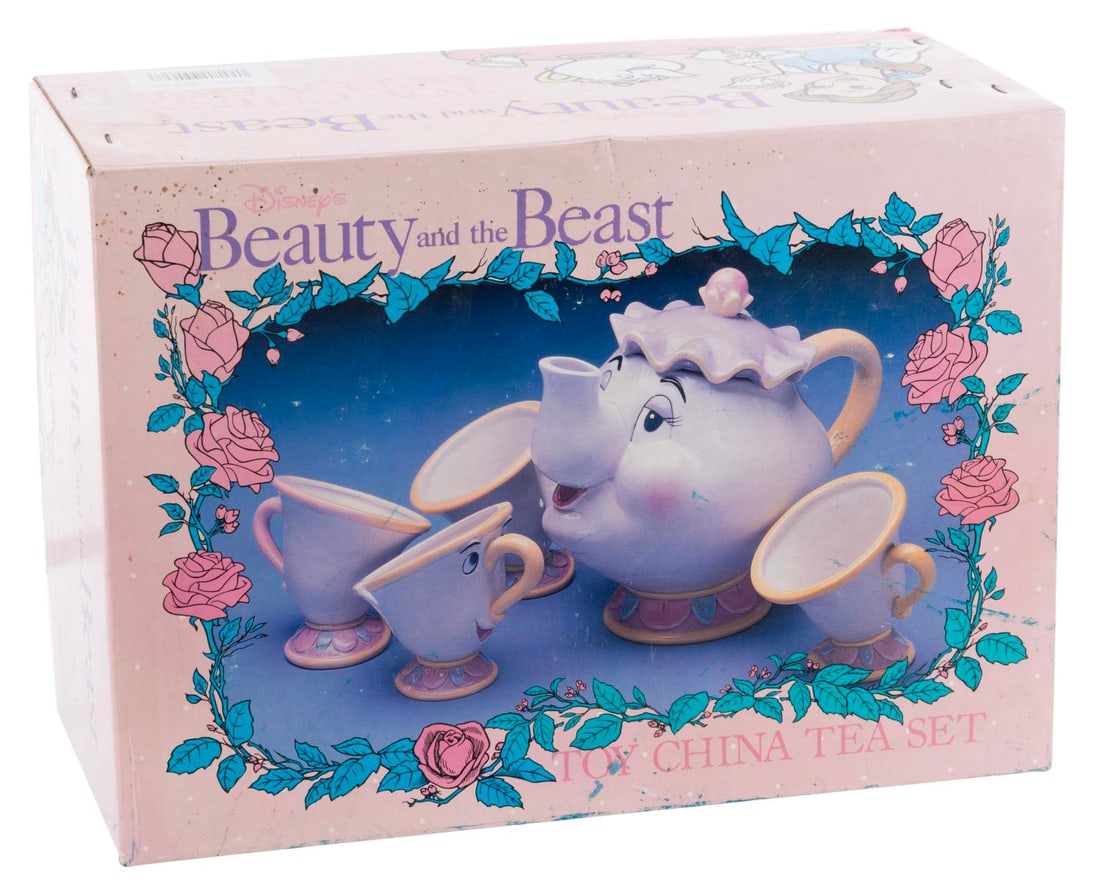 A "Beauty and the Beast" China Toy Tea Set.: (Disney, 1990s) A "Beauty and the Beast" Toy China Tea Set with a Mrs. Potts tea pot, Chip, and three other tea cups. From the 2.5" x 2.5" x 3.5" tea cups to the 7" x 4.75" x 5" high Mrs. Potts, the