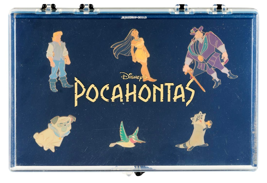 A 6-Piece "Pocahontas" Character Pin Set.: (Disney, 1995) A six-piece "Pocahontas" pin set featuring Pocahontas, John Smith, Meeko, Flit, Percy, and Governor Ratcliffe. The set was released at the Disney Store to coincide with the theatrical