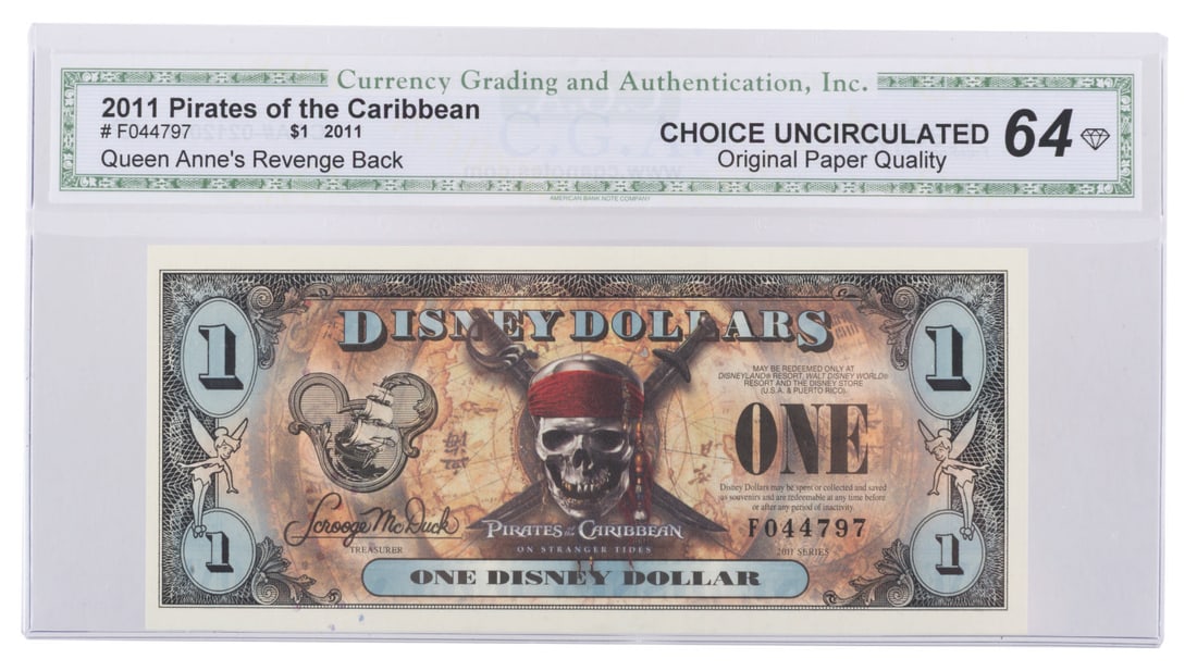 A Rare Uncirculated "Pirates of the Caribbean: On Stranger Tides" Disney Dollar.: (Disney, 2011) An extremely rare uncirculated "Pirates of the Caribbean: The On Stranger Tides" $1 Disney Dollar, featuring the Queen Anne's Revenge on the back. The uncirculated bill from the 2011 Se