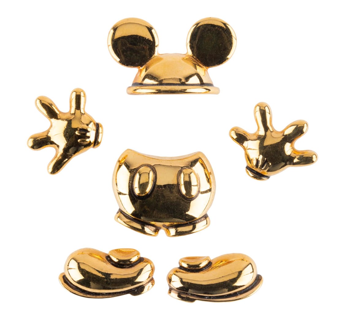 A Set of Disassembled Mickey Mouse Pins.: (Disney, 1990s-2000s) A set of six pins of Mickey's shoes, shorts, gloves, and ears. The set is in very good condition.