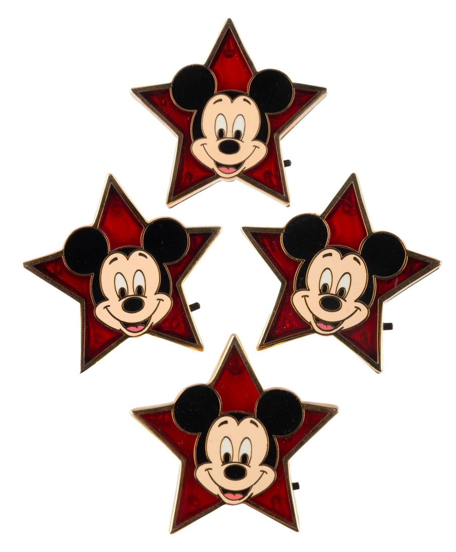 A Set of Mickey Mouse Star Light-Up Pins.: (Walt Disney World, 2003) A collection of four working light-up Mickey star pins. Switched on, each quickly flashes four points red and the top point blue. Measuring 1.5" x 1.5", the pins are in very 