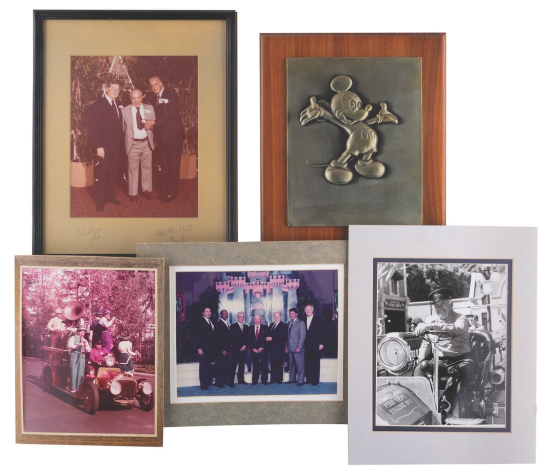 A Ralph Hanson Retirement Plaque with Photos.: (Disney, 1963-1989) A Ralph Hanson retirement Mickey Mouse plaque and four photos. The plaque features the corporate "Ta-Da Mickey" with a bronze finish and is engraved "Thanks, Ralph Mickey and the