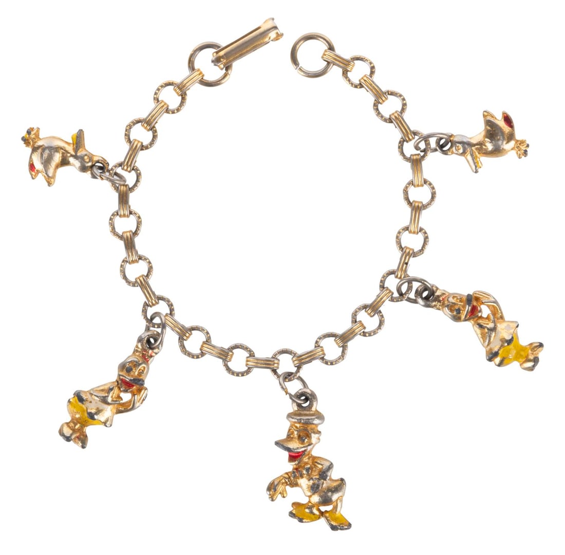 An Early Disneyland Charm Bracelet.: (Disneyland, 1950s) An early Disneyland bracelet featuring five figural charms of Donald and Daisy Duck with baby ducks. Measuring 6" long, the bracelet displays in good condition with heavy paint