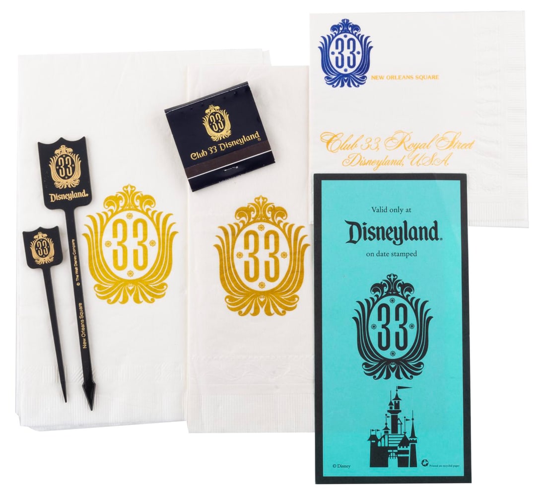 A Collection of Club 33 Momentos.: (Disneyland, 1990s-2000s) A collection of momentos from Disneyland's exclusive, members-only, Club 33. Included are two large napkins, a cocktail napkin, one large and one small swizzle stick, an unus
