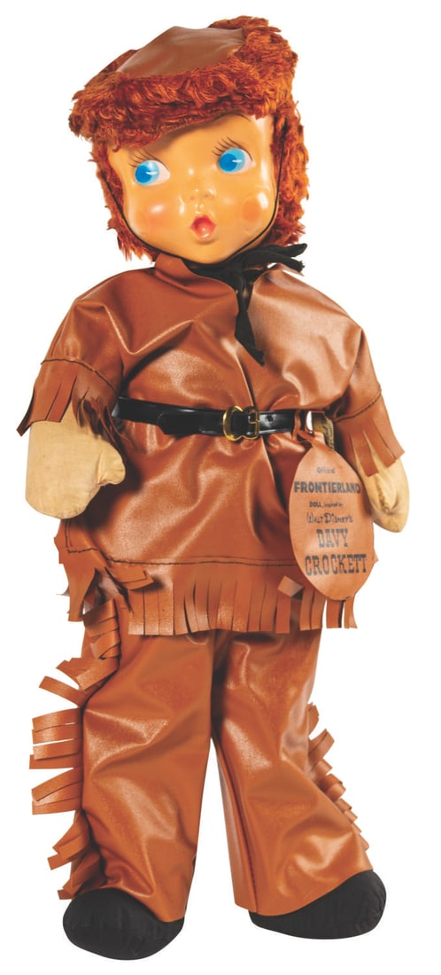 A Gund Davy Crockett Frontierland Doll.: (Disneyland, 1950s) A rare vintage Disneyland Frontierland Davy Crockett doll. Created during the height of Crockett-mania, the doll includes its "Official Frontierland Doll inspired by Walt Disney's 