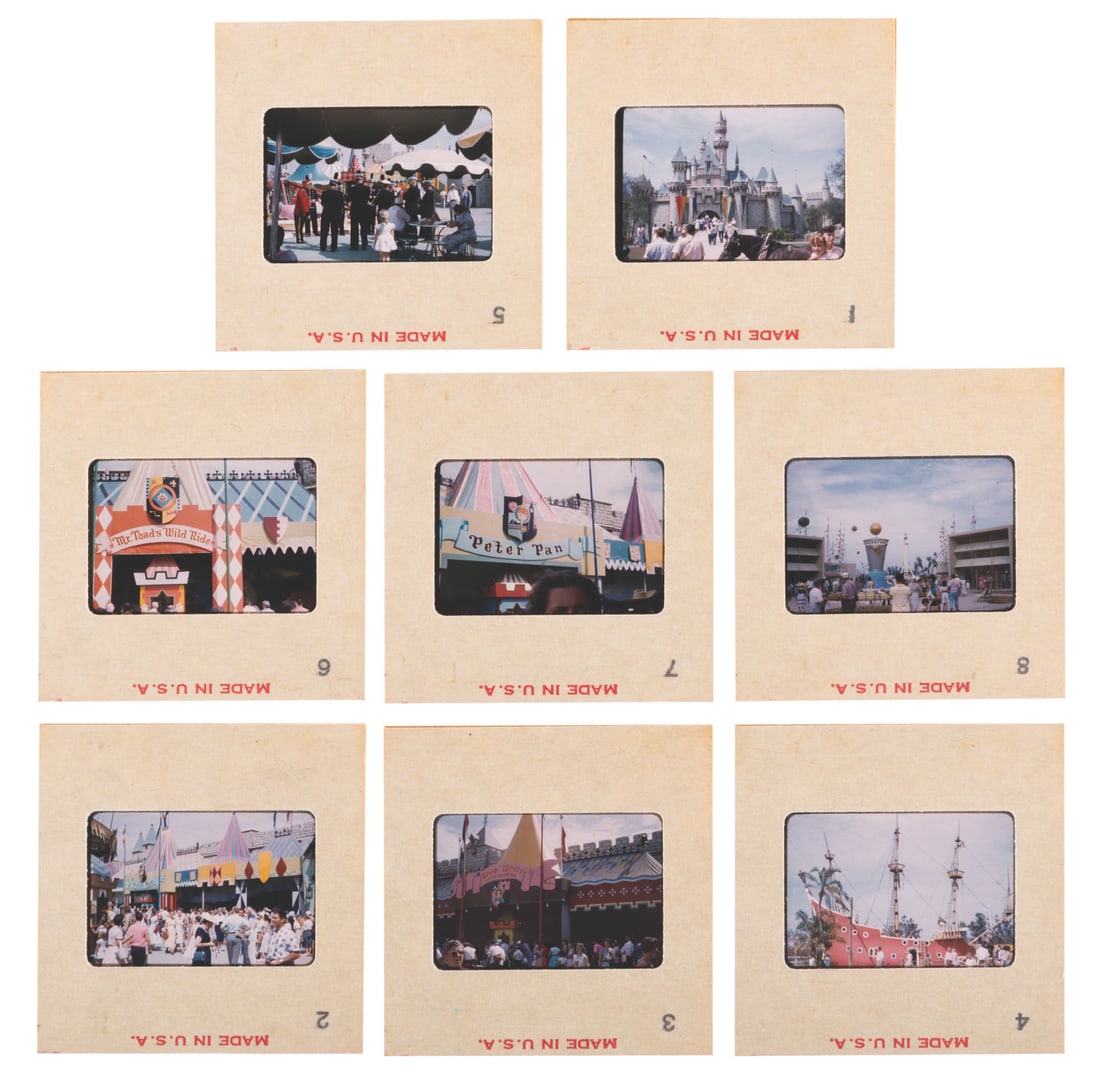 A Collection of Early Fantasyland Ride Facade Slides.: (Disneyland, 1950s) A collection of eight color slides taken by a Guest in Disneyland. Seven feature images of the original Fantasyland ride facades, and one features the World Clock at the entrance