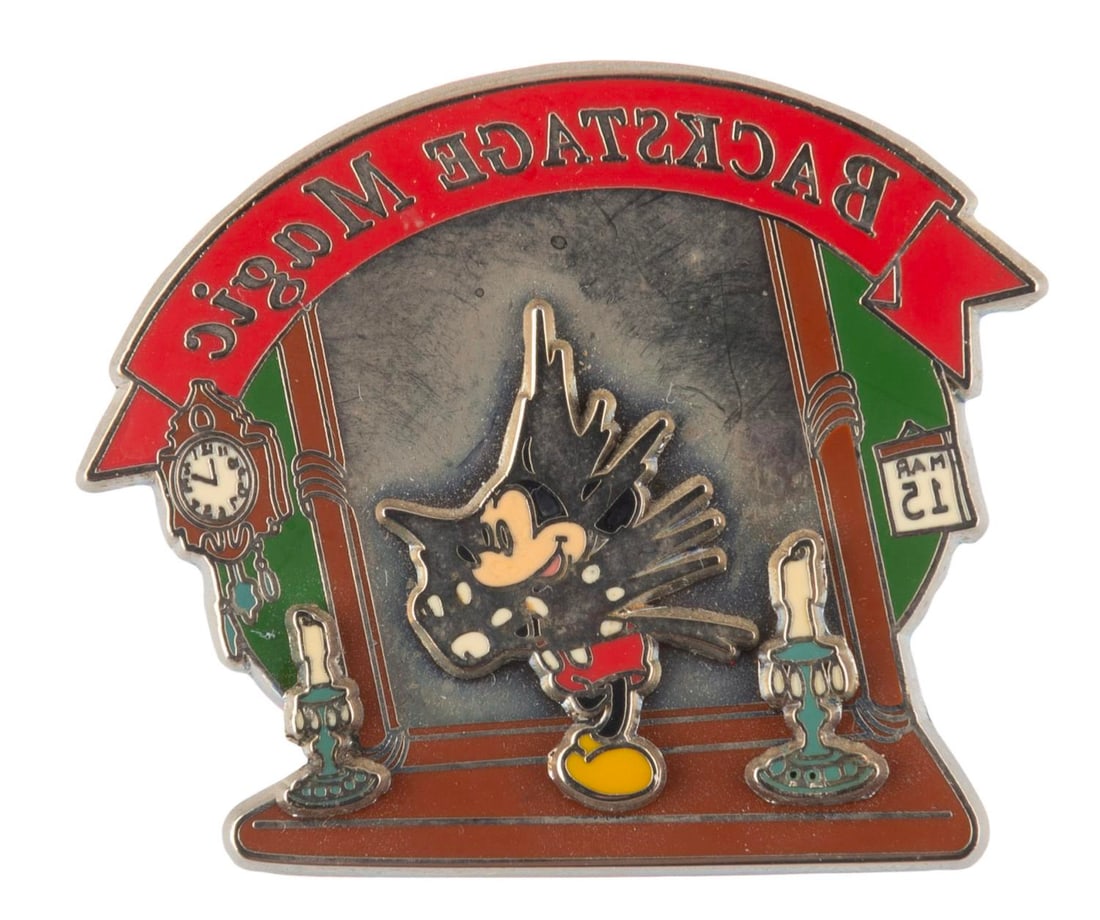 A Backstage Magic Mickey Mouse Pin.: (Walt Disney World, 2002) A pin featuring Mickey Mouse inspired by the "Through the Mirror" animated short, given to Guests who participated in the 7 hour Backstage Magic Tour at Walt Disney World.