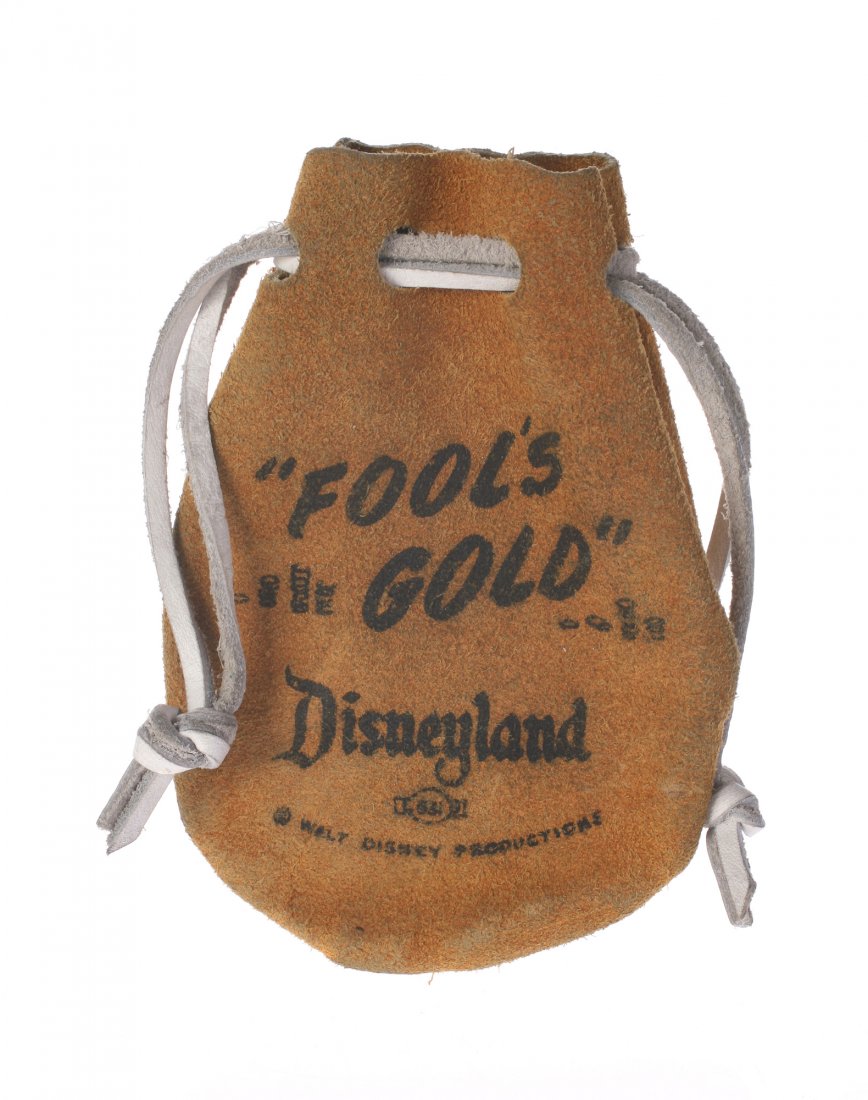 Disneyland "Fool's Gold" Leather Pouch.: (Disneyland, 1950s) An early park souvenir, this leather pouch reads "Fool's Gold" on the front. Contains (7) small rocks. Measures 3.25"x4.5". In good condition with minor discoloration.
