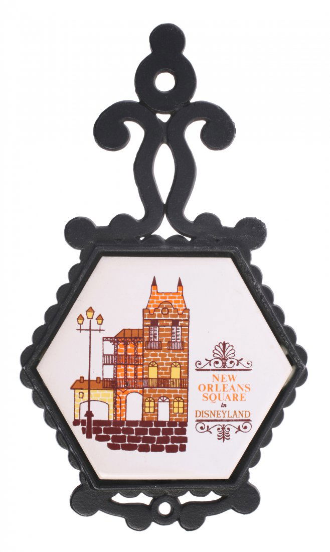 Pair of (2) New Orleans Square Trivets.: (Disneyland, 1960s) Includes (1) six-sided and (1) four-sided cast iron and ceramic tile trivet with New Orleans Square imagery. Pair is in good condition.
