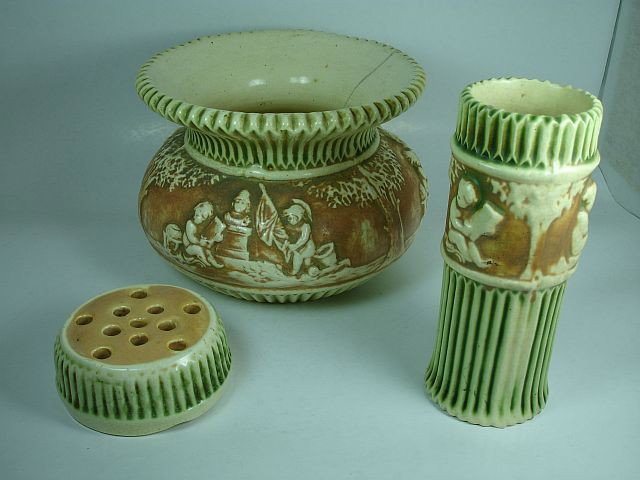 Three pieces Roseville Donatello pottery: Frog, Vase 6.25" h Spittoon with crack