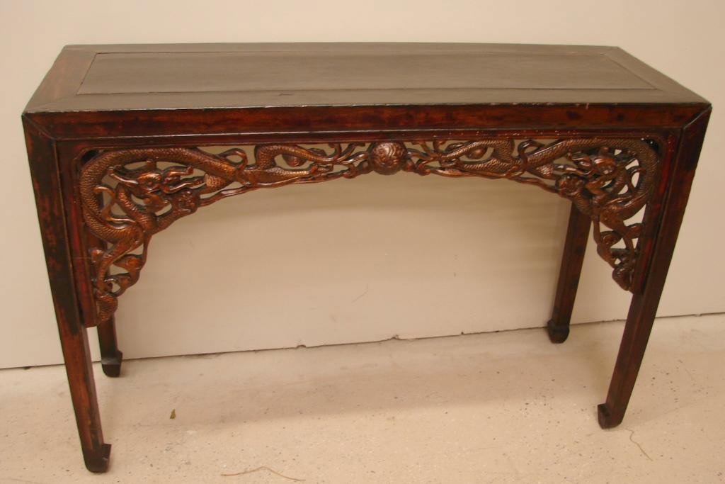 Antique Oriental sofa table with carved fretwork: Dimensions: 51" w x 17.5" d x 34.5" h Slight wear on top of altar table