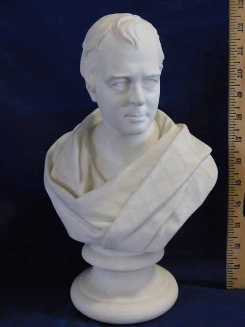 Unmarked Parian Bust: 13" tall and depicts a man draped in patterned cloth. Well known figure of the mid-late 1800's and could be identified with a search of Parian related websites. Figure and base are free of damage and 