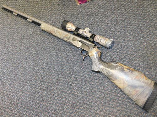 Encore Pro Hunter 209 x 50 Magnum Black Powder Rifle: Encore Pro Hunter 209 x 50 Caliber Magnum Black Powder Rifle with Nikon scope. Camouflage design on rifle and scope.
