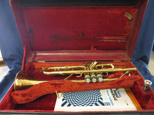 King Super 20 Trumpet by H.N. White Co. Sn: 337780.: King Super 20 Trumpet by H.N. White Co. Sn: 337780. In hard case with a soft case covering the hard case.