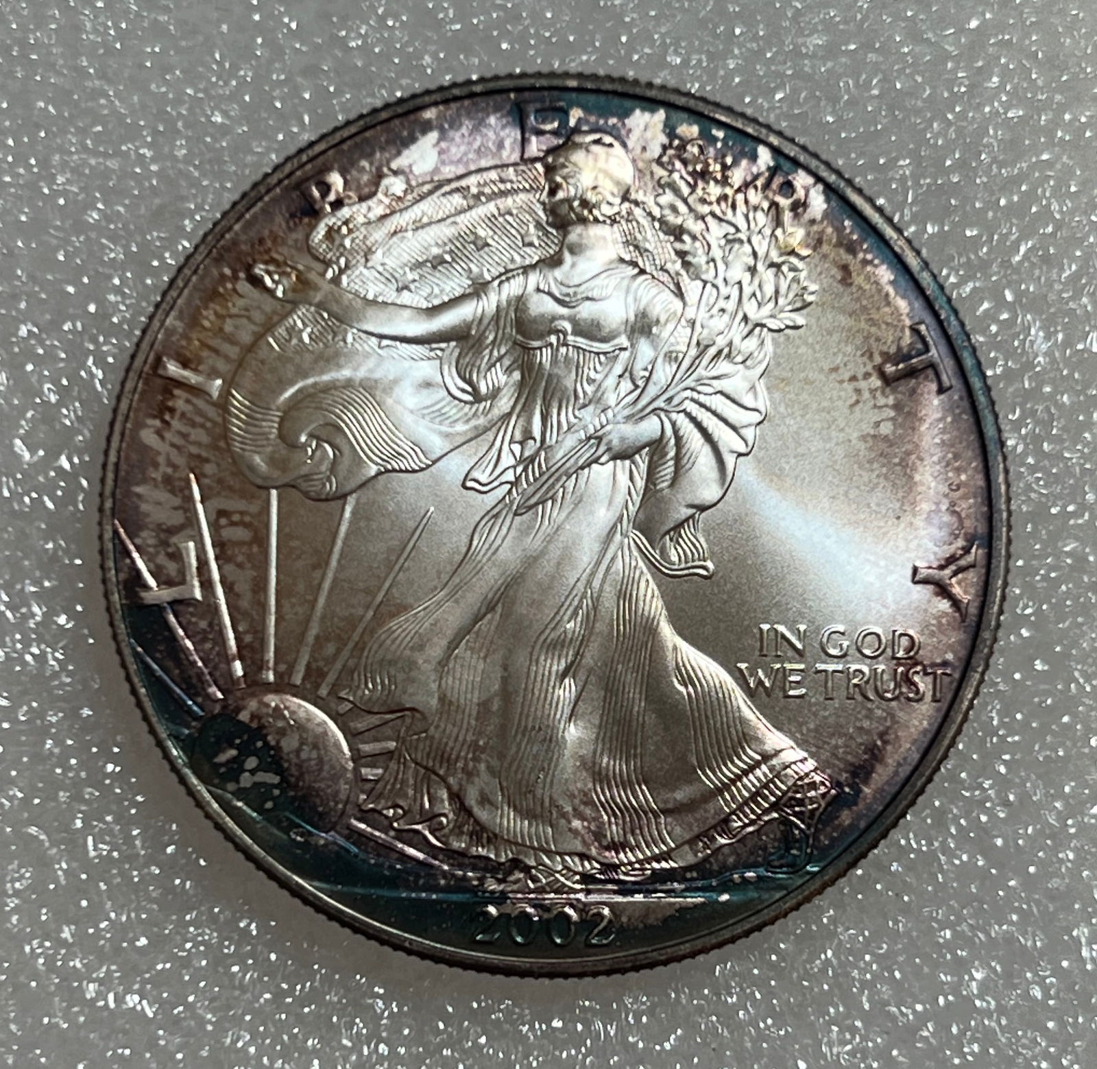 2002 1 oz. $1 Silver American Eagle BU Rainbow Toning (1 of 2)