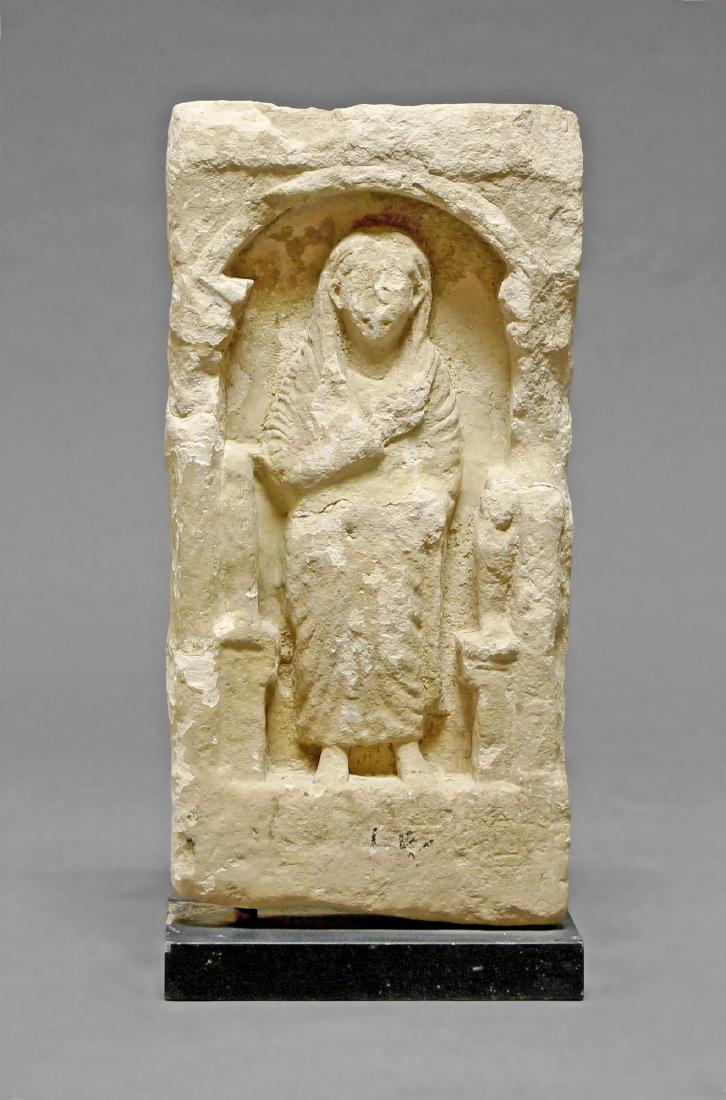 A Roman limestone funerary stele from Egypt, probably: A Roman limestone funerary stele from Egypt, probably 2nd-3rd century A.D, 52 x 25cm. (VAT charged on hammer price)