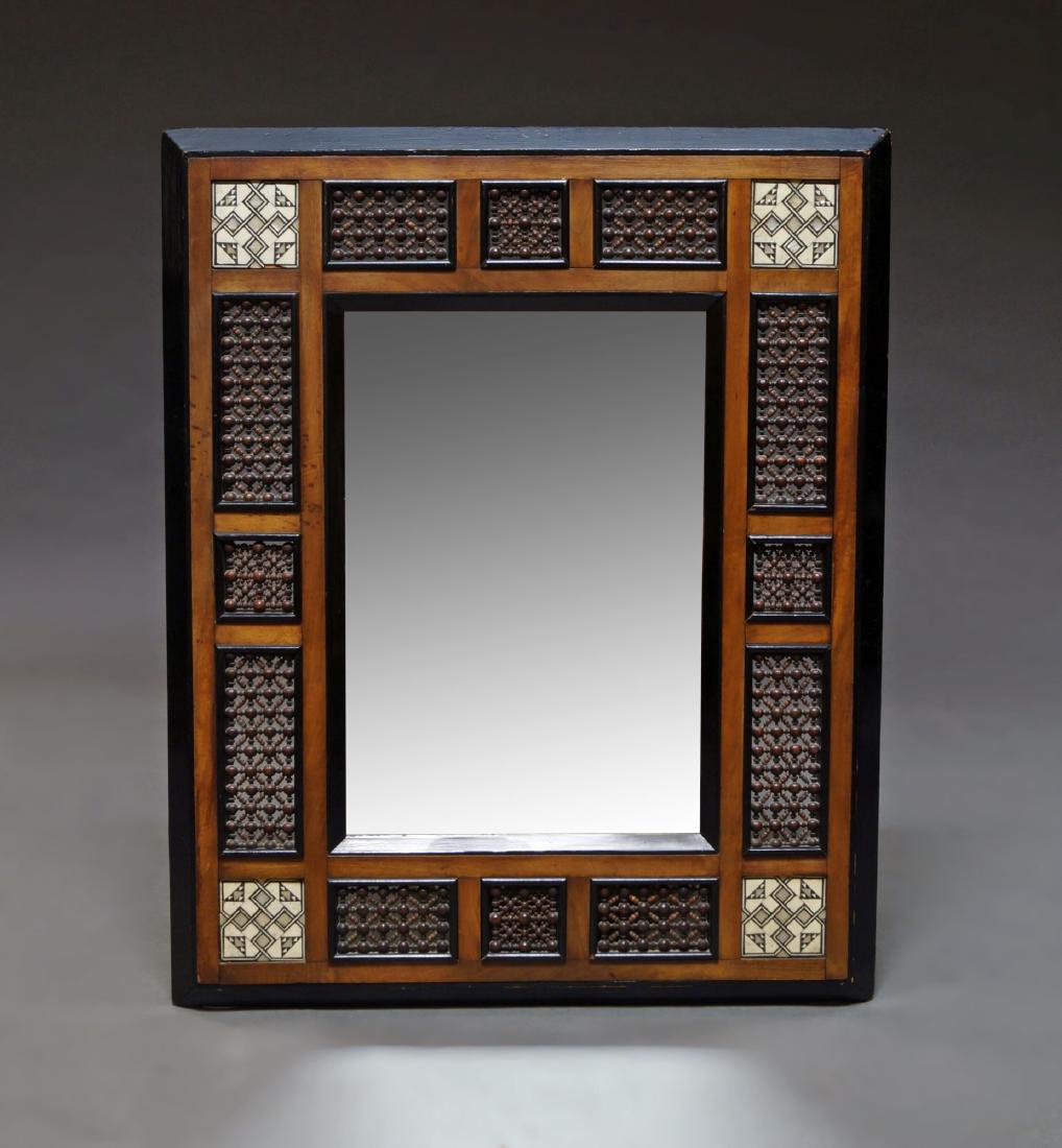 A hardwood, ebonised and bone inlaid rectangular: A hardwood, ebonised and bone inlaid rectangular mirror, Syria, 20th century, inset with panels of mashrabiyya work, 78 x 63cm