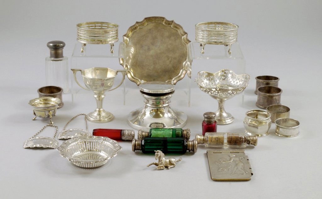 A collection of silver to include a capstan inkwell,: A collection of silver to include a capstan inkwell, c.1940, a silver bowl of plain form, quantity of napkin rings, various dates and makers, a silver waiter, c.1971, A.E. Jones, silver salts, pin tra
