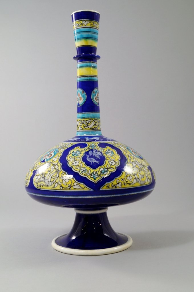 A large impressive Theodore Deck bottle vase, of: A large impressive Theodore Deck bottle vase, of Islamic taste, 19th century, the cylindrical neck decorated with blue and yellow bands, the ovoid body decorated with exotic birds and animals between