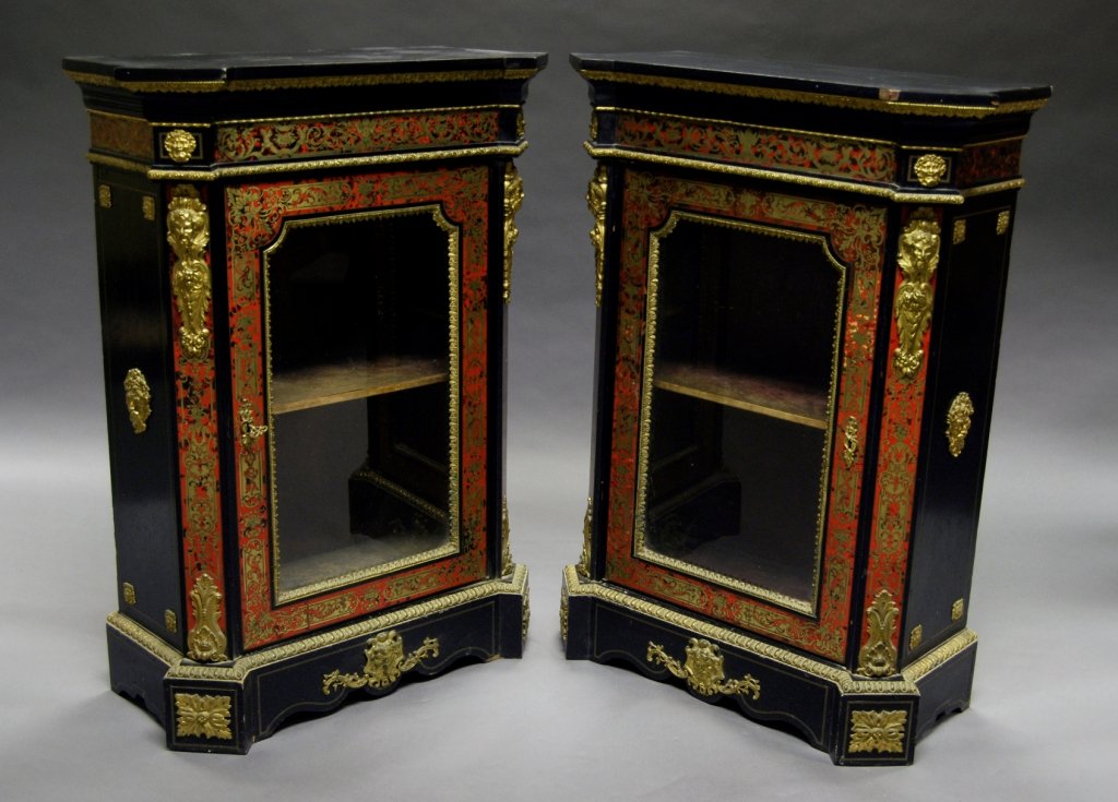 A pair of Victorian ebony, boulle work, tortoiseshell: A pair of Victorian ebony, boulle work, tortoiseshell and gilt metal mounted pier cabinets by Wilkinson & Son, with protruding square cornered top and boulle work frieze, above a boulle work and glaze
