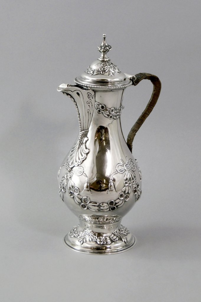 A George III silver coffee pot, c.1771, by Charles: A George III silver coffee pot, c.1771, by Charles Wright, of baluster form with repoussé floral swags and ribbons, approx 29cm highm approx 24oz.