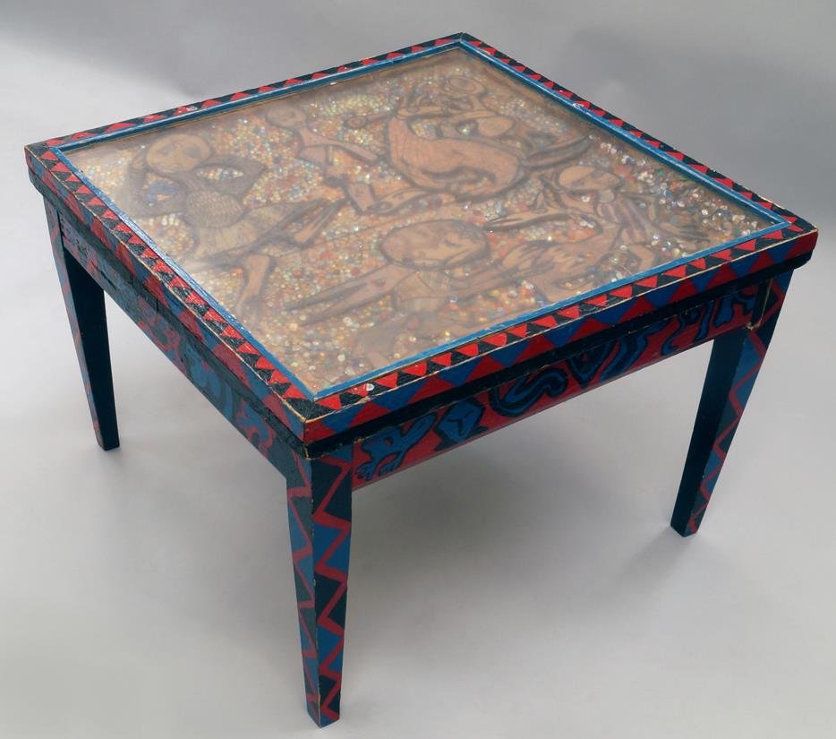 Twins Seven-Seven, Nigerian 1944-2011- A carved and: Twins Seven-Seven, Nigerian 1944-2011- A carved and painted table; mixed technique on panel, 42.5x61x61cm