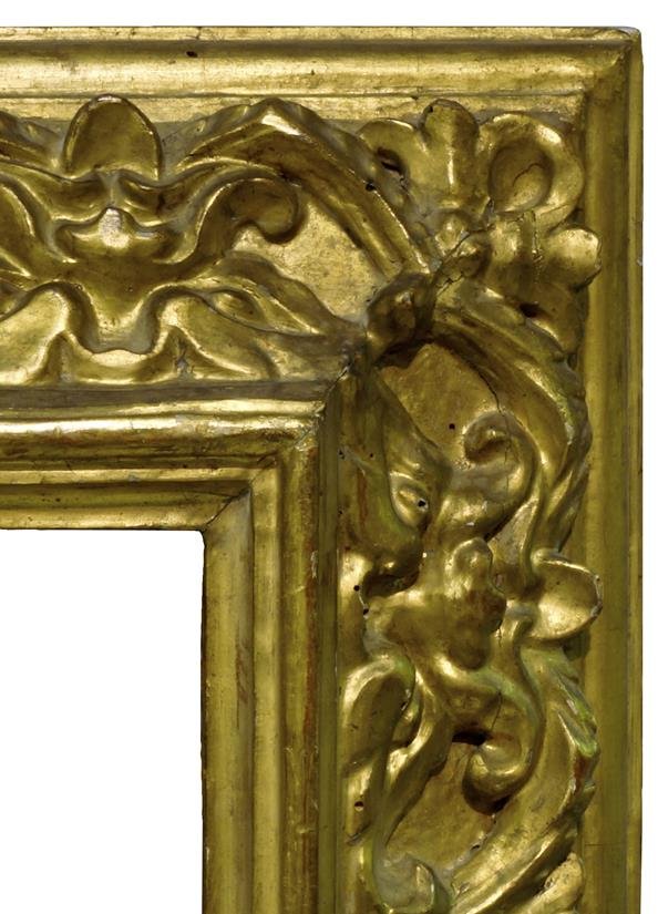 A Spanish Carved and Gilded Baroque Frame of Reverse: A Spanish Carved and Gilded Baroque Frame of Reverse Section, 17th century, with stepped cavetto sight, torus and stylised leaf, plain ogee back edge, 61x72cm