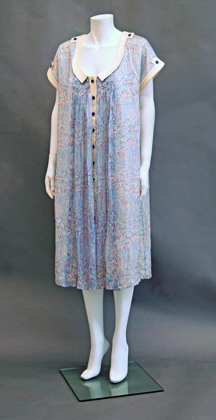 Bill Gibb: A smock dress of bamboo print chiffon with: Bill Gibb: A smock dress of bamboo print chiffon with smocking details to front and back, scooped neckline with cream Peter Pan collar and cuffed cap sleeves, size 10. Provenance: From the collection
