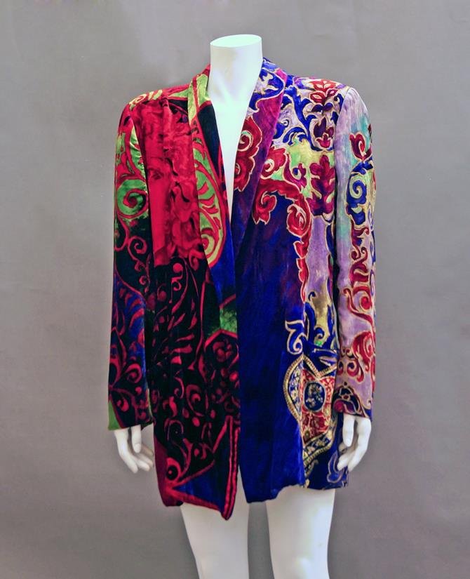 Gianni Versace: A multi colour printed silk velvet: Gianni Versace: A multi colour printed silk velvet jacket, with shawl collar and printed silk lining, together with a pair of rose tinted sunglasses, with Medusa head emblems, both by Versace. (2) Pro