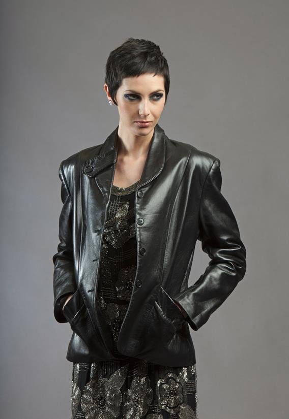 Norma Kamali: A black leather fitted jacket, with: Norma Kamali: A black leather fitted jacket, with button tab detail to the lapel and sloping front pockets, size 12, together with a grey wool A-line coat by Philippe Venet, Paris, with mandarin colla