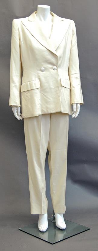 Yves Saint Laurent: A ivory linen tuxedo-style trouser: Yves Saint Laurent: A ivory linen tuxedo-style trouser suit, 1990s, single button double-breasted jacket with wide lapels and straight legged trousers. Provenance: From the collection of Suzy Menkes.